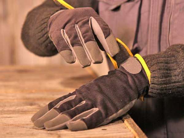 Gloved hands as a precaution while handling borax